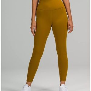 Lululemon wunder train high rise 25 inch leggings. olive green/gold color.
